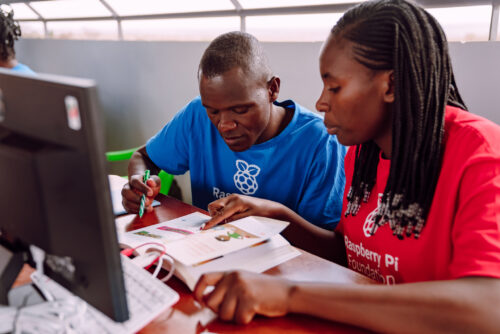 Two Kenyan educators work on a physical computing project.