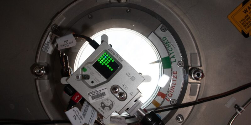 An Astro Pi unit at a window on board the International Space Station.