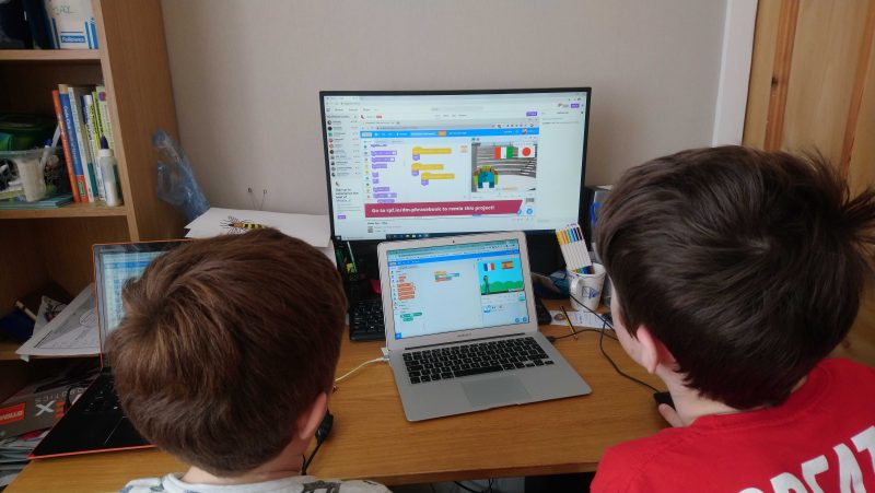 Two kids doing digital making at home