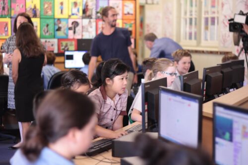 A computing classroom filled with learners