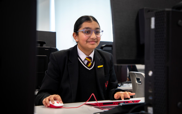 A student using a Raspberry Pi computer.