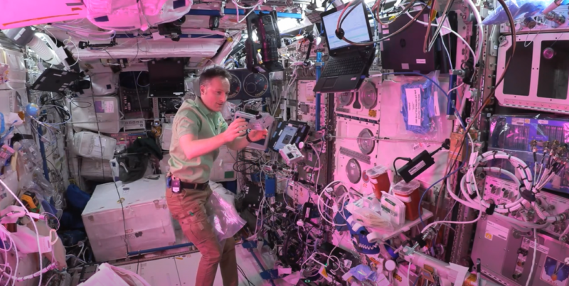Matthias on the ISS, catching Astro Pis in microgravity.